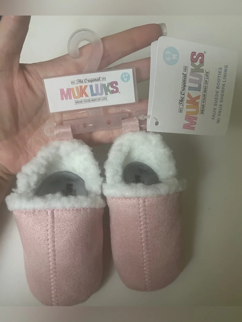 MukLuks pink baby booties 6-9M